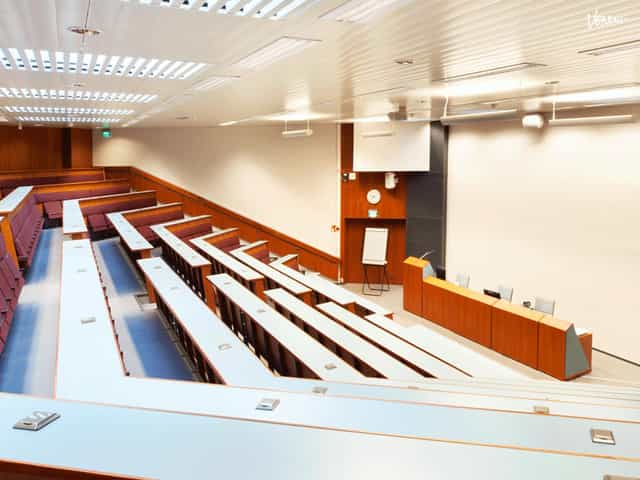 Modern auditorium with tiered seating for events in Hotel Haaga Central Park.