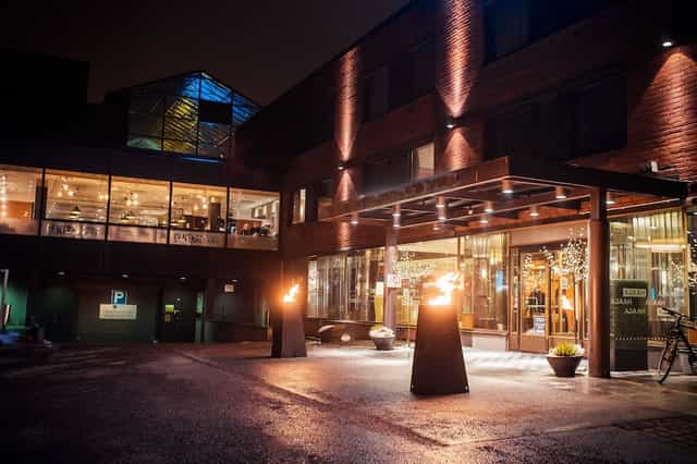 Modern convention center entrance at Hotel Haaga Central Park, ideal for upscale events.