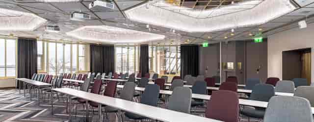 Modern banquet hall with flexible seating at Hilton Helsinki Airport for meetings and events.