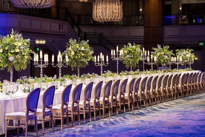 Elegant banquet table with floral centerpieces in Marriott Bonvoy event hall.