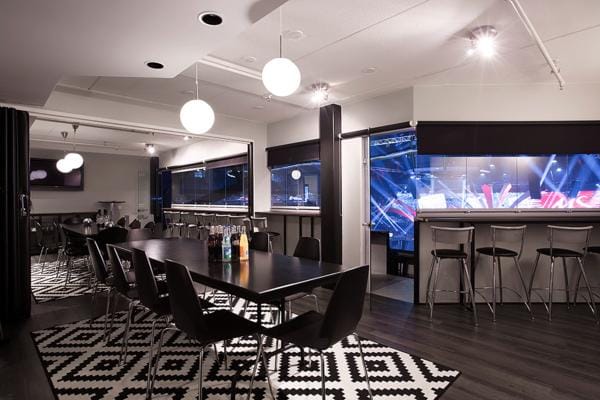 Contemporary meeting space in Dipoli with large windows for networking events.