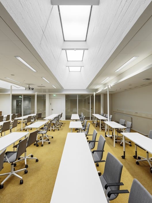 Modern conference room with collaborative seating at Aalto University for workshops and meetings.