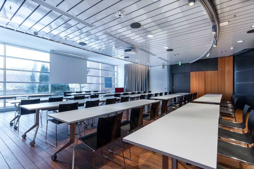 Modern meeting room in PWC Hall, Aalto University; perfect for conferences and workshops.