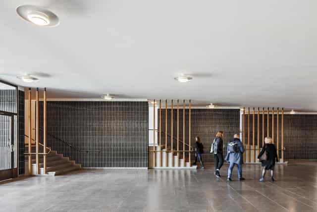PWC Hall at Aalto University: modern venue with natural lighting for events and meetings.