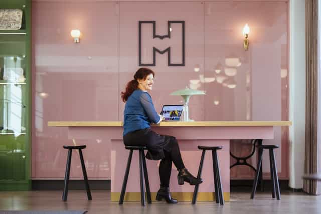 Helsinki City Museum lobby with modern workspace for creative meetings and collaboration.