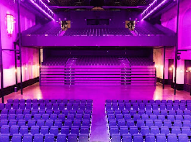 Teatro Principe Pio lobby with purple seats, ideal for conferences and performances.