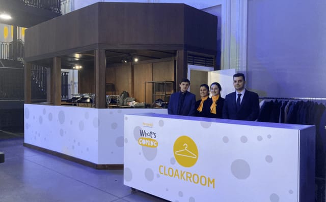 Modern cloakroom at Teatro Principe Pio event, showcasing efficient guest services.