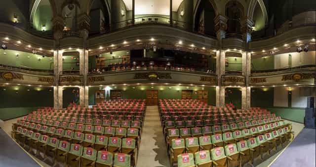 Fernando de Rojas Theatre auditorium, elegant setup for conferences and ceremonies.