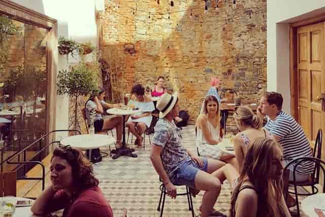 Vibrant outdoor café at The Gin Bar, perfect for networking and casual meetings.
