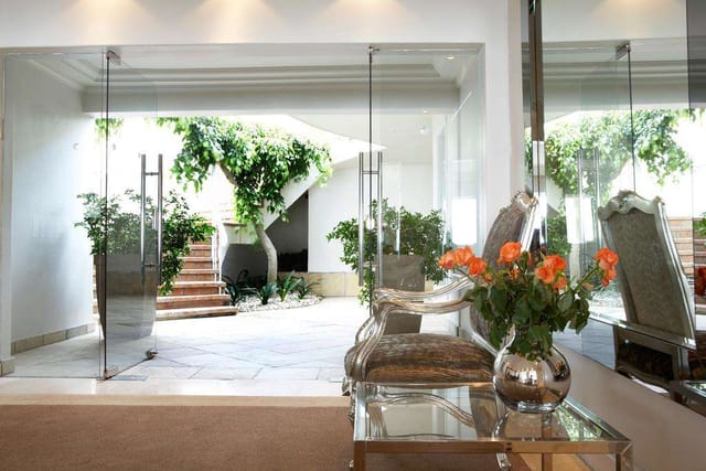"Elegant entrance of The Clarendon Entertainment Room for events and meetings"