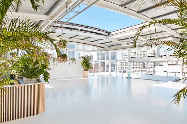 Modern rooftop event space with open layout, perfect for corporate meetings and social events.