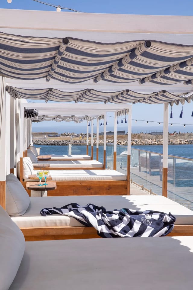 Champagne Deck at Cabo Beach Club: elegant cabanas, ideal for exclusive outdoor events.