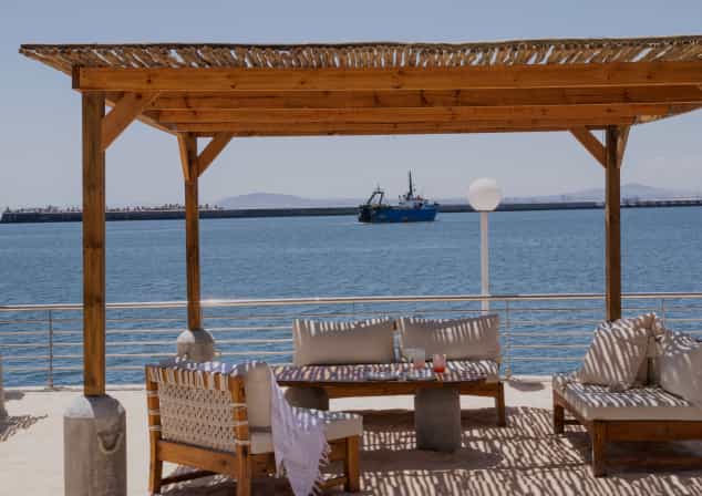 Cabo Beach Club venue with wooden pergola for relaxed networking events.