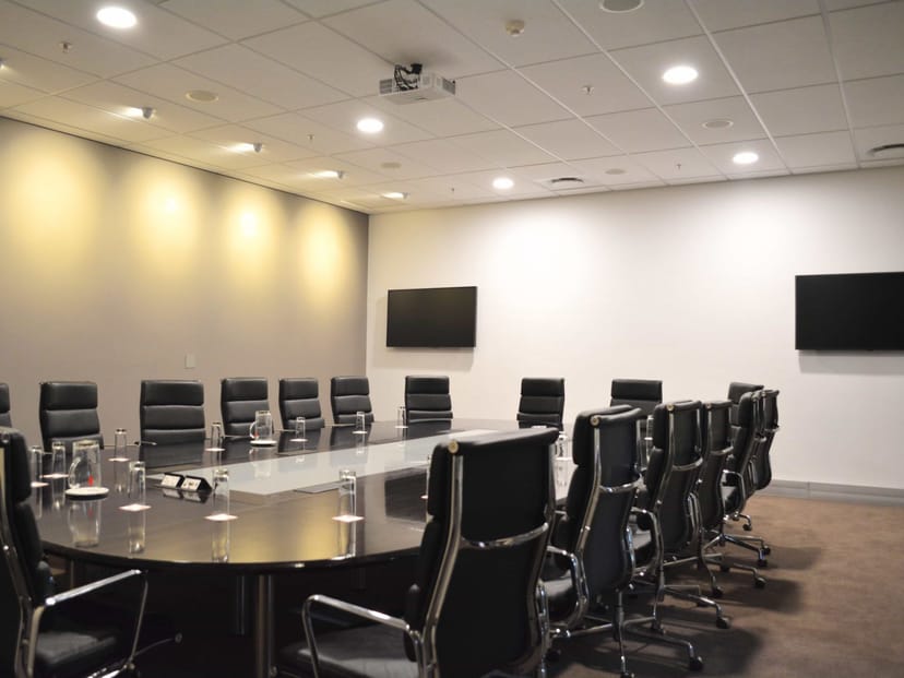 Modern conference room with ergonomic chairs and dual screens at CTICC. Ideal for meetings.