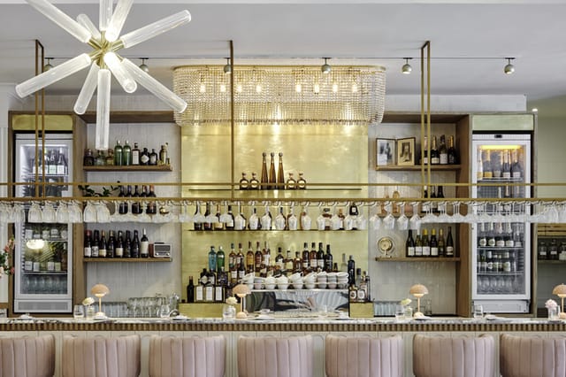 "Stylish bar area by Kove Collection, ideal for networking events and cocktails."