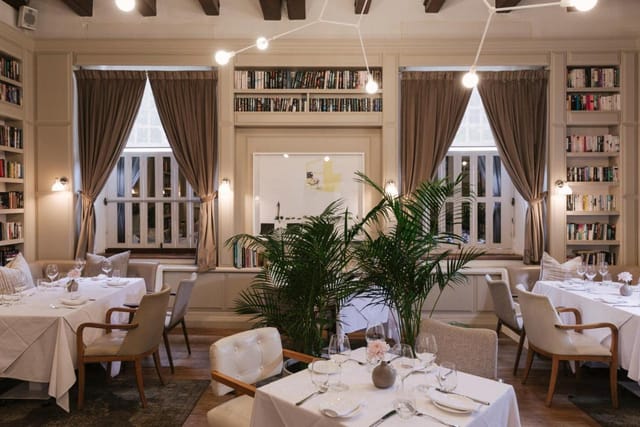 Elegant restaurant space with cozy seating at The Alphen Hotel for intimate events. 
