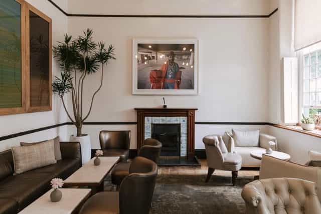 Elegant meeting space with natural light at The Alphen Boutique Hotel & Spa. Ideal for gatherings.