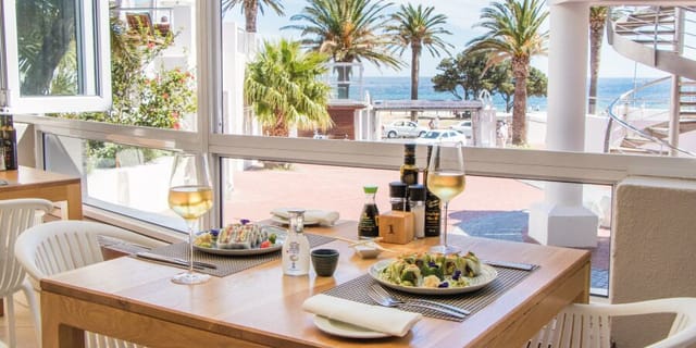 Tides Celebration Deck dining table with ocean view, ideal for networking lunches and events.
