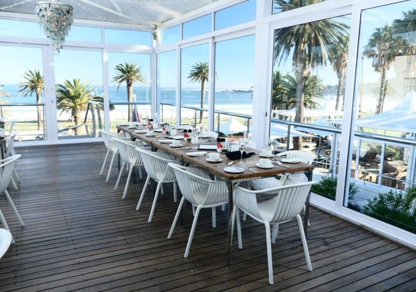Tides Celebration Deck at The Bay Hotel: elegant dining, beachfront views, corporate events.