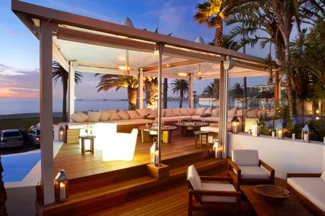 Sandy B Private Beach Club outdoor venue with plush seating for upscale events and gatherings.