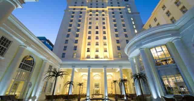 Elegant Cullinan hotel facade at dusk, perfect for upscale corporate events and gatherings.