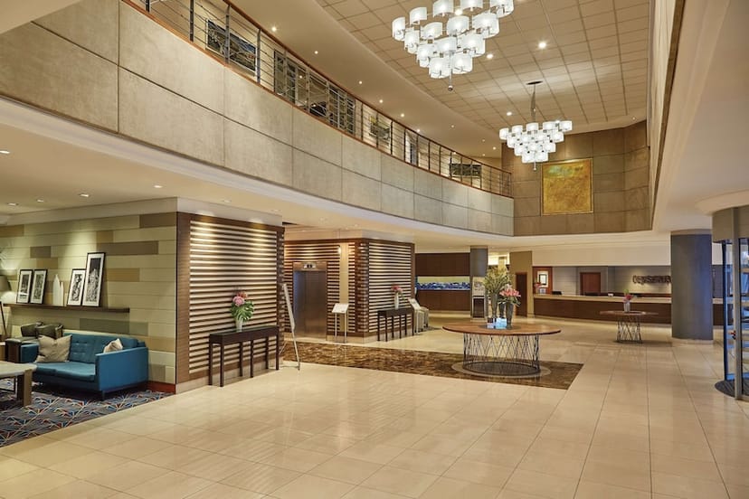 Modern hotel boardroom with elegant chandeliers for conferences and events.