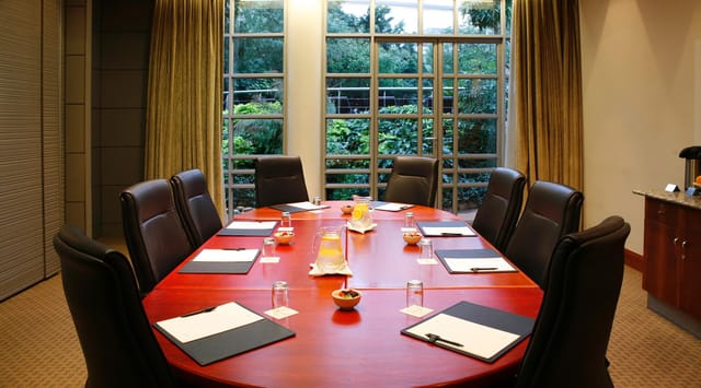 "Boardroom 1 & 2 at Southern Sun Waterfront, featuring a round table for meetings."