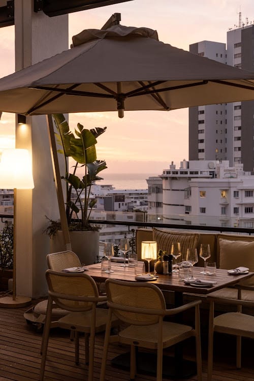 Rooftop Restaurant in Kove Collection with sunset view, ideal for events and dinners.