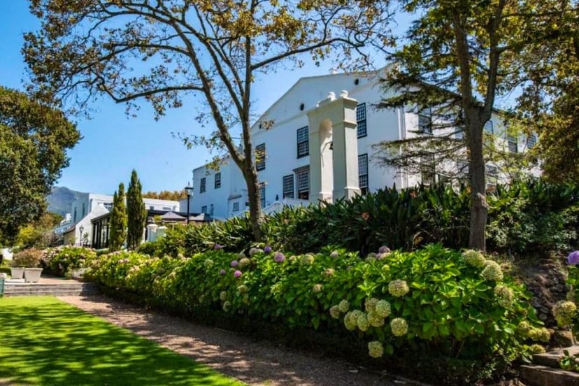 Elegant suite at The Alphen Boutique Hotel, ideal for outdoor corporate events.