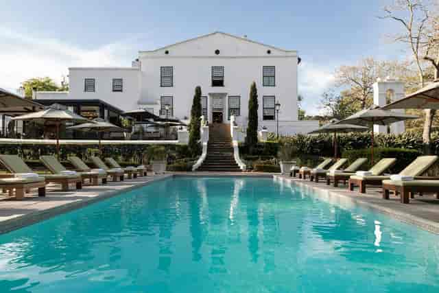 Alphen Boutique Hotel suite with serene pool, ideal for upscale events and receptions.