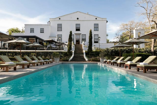 Alphen Boutique Hotel suite with serene pool, ideal for upscale events and receptions.