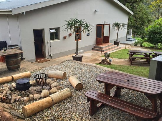 Farmhouse Erika outdoor space with fire pit, perfect for team-building events and workshops.