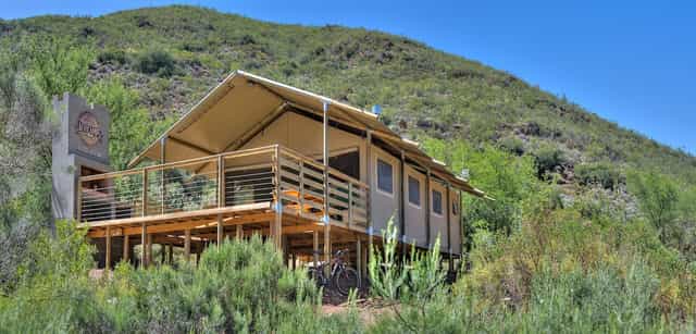 Cottages in Pat Busch Mountain Reserve, featuring a spacious deck for outdoor retreats.