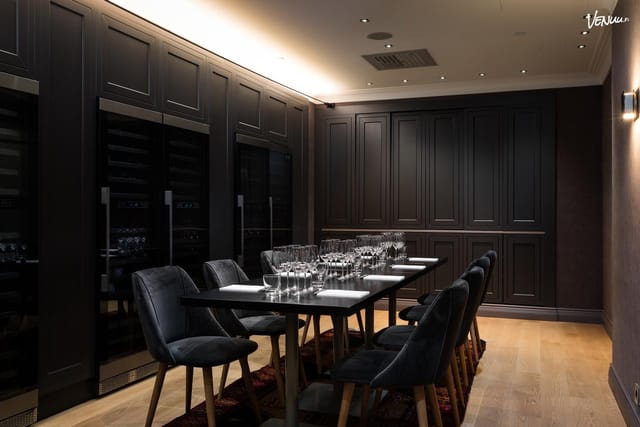 Sleek Wine Room Kalervo, modern meeting space for corporate gatherings and socializing.