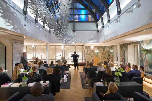 Sophisticated Winter Garden event space with modern decor for corporate seminars.