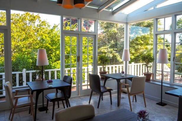 Greenhouse Restaurant meeting space with natural light, ideal for events and gatherings.