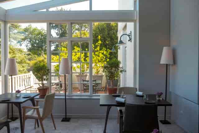 Greenhouse Restaurant event space with large windows for intimate meetings and private dining