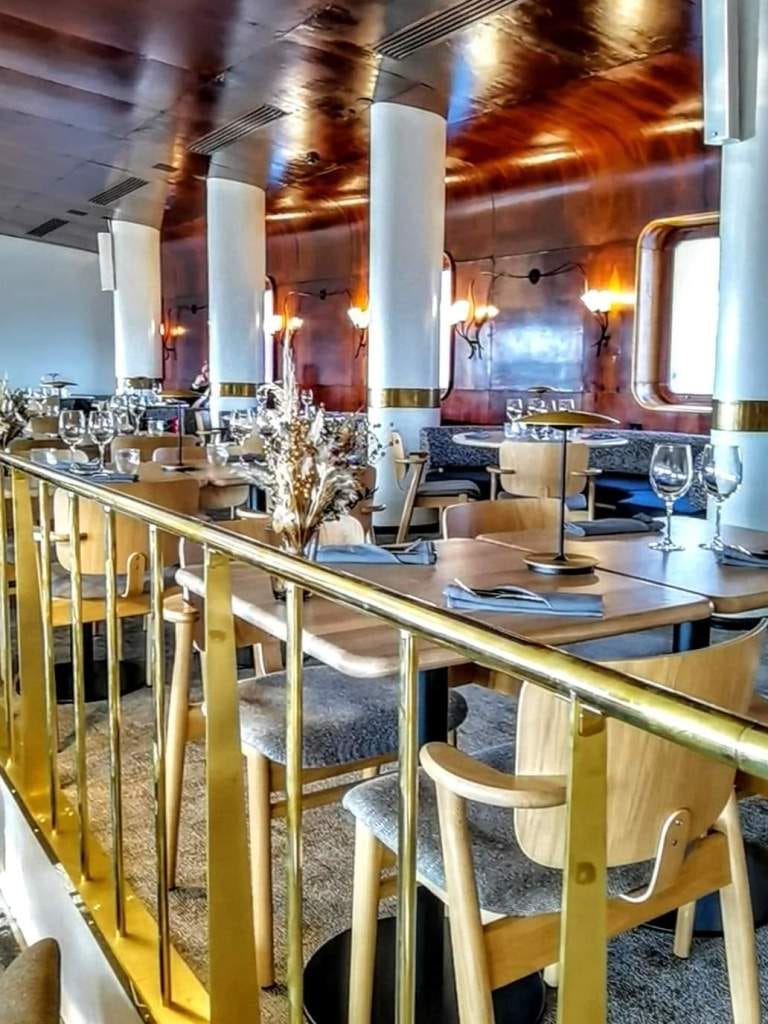Elegant restaurant dining setup for corporate events and gatherings, featuring stylish decor.