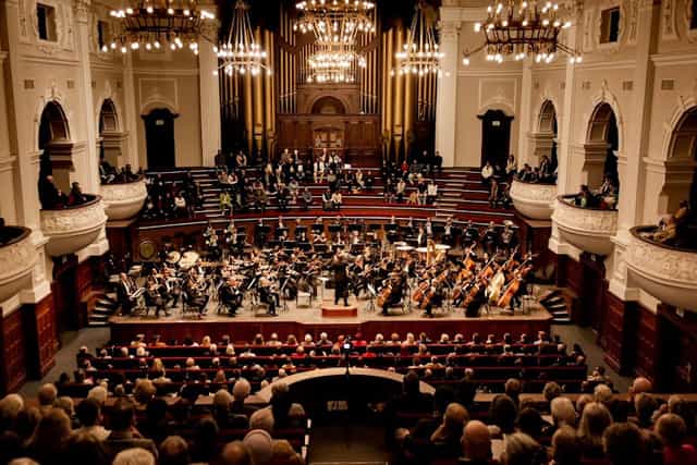 Cape Town Philharmonic Orchestra rehearsal highlighting elegant acoustics and cultural experience.