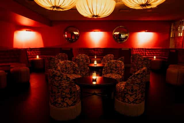 Red Room at Belmond Mount Nelson: elegant lounge with cozy red lighting for events.