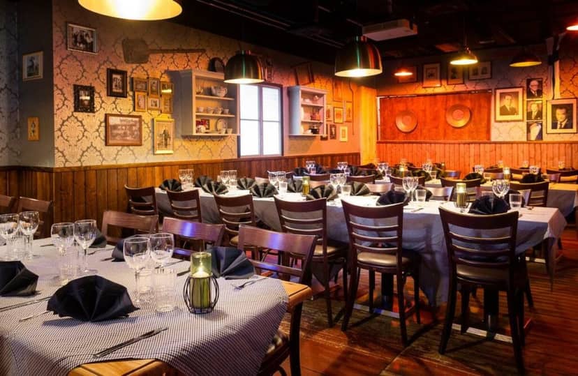 Elegant dining setup in Herrasväen Huone for formal events and corporate dinners.