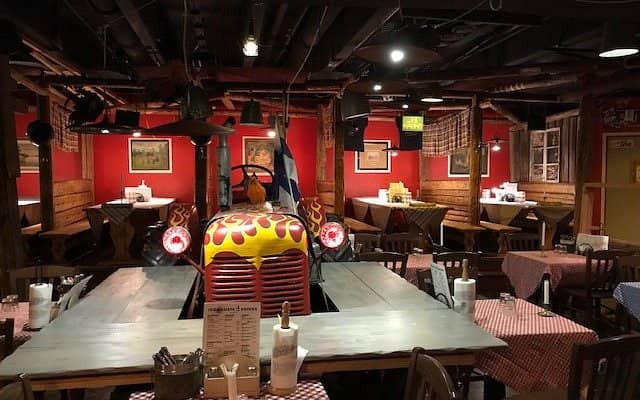 Rustic Restaurant Zetor with wooden tables, perfect for dining and networking events.