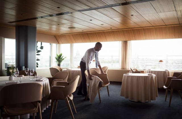 Elegant setting at Palace Restaurant for corporate dinners and private events, with panoramic windows.