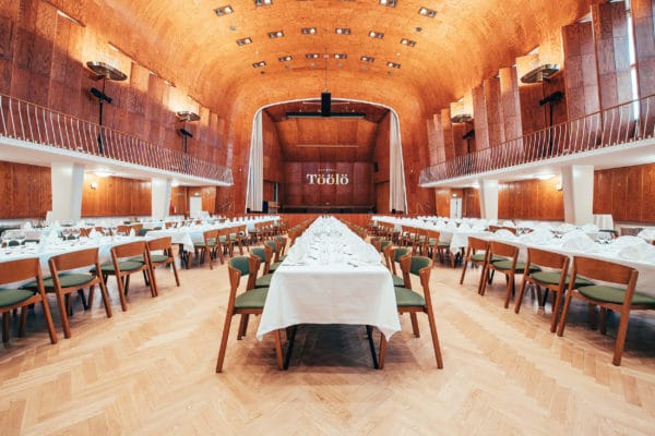 Elegant Auditorium Foyer with wooden paneling, perfect for banquets and formal events.