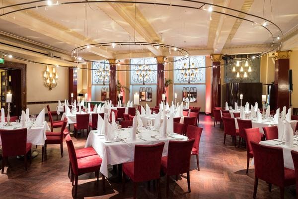 Elegant Ballroom Lobby setup with round tables for sophisticated dinners and corporate events.
