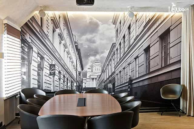 Modern meeting room at Roba Lounge with urban mural, perfect for executive sessions.