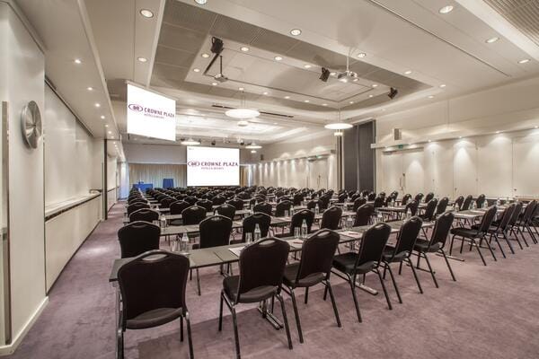 Hesperia Ballroom conference room with dual screens for corporate meetings and events.