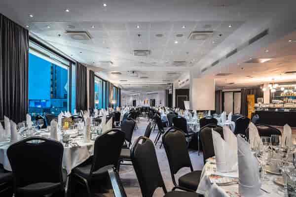 Elegant dining space at LUMO, Crowne Plaza Helsinki for corporate events and formal dinners.