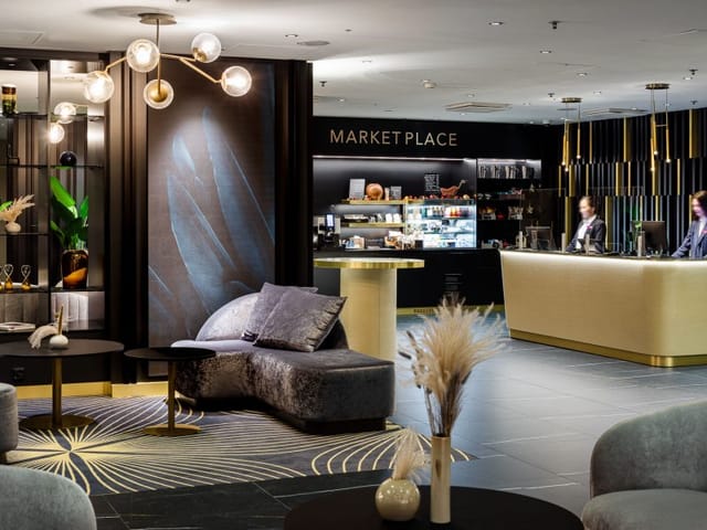 Modern lobby at Crowne Plaza Helsinki, ideal for stylish meetings and events.