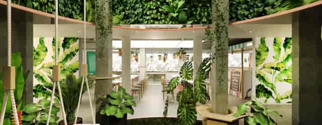 Garden Hall at HUONE Helsinki: vibrant event space with greenery for workshops and networking.